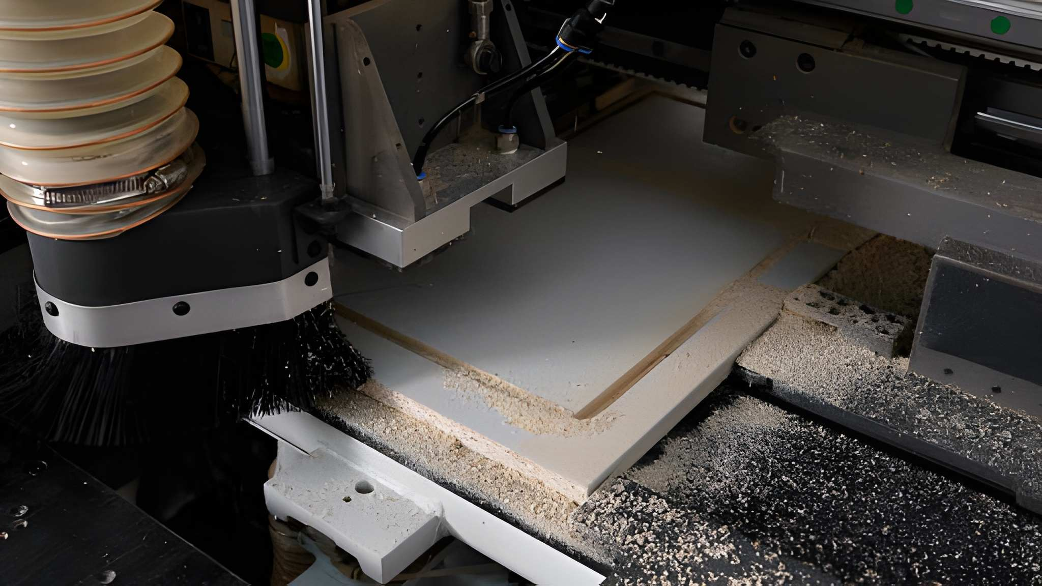 CNC machine routing a wood panel